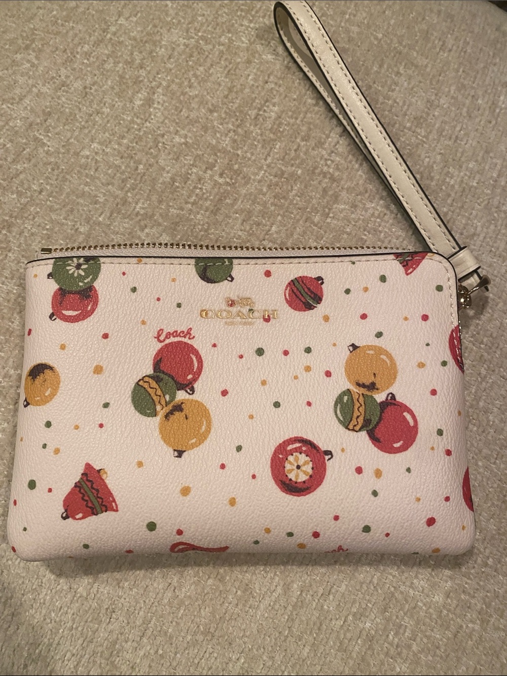 Coach Cream Wristlet with Red, Green & Gold Ornament Print